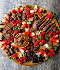 Chocolate Dessert Board A Decadent Chocolate Board With An Assortment Of Chocolate Truffles Milk Chocola In 2020 Party Food Platters Food Platters Charcuterie Recipes