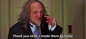 Woman lying on her bed, with a bowl full of popcorn while scared watching a horror movie with the lights off, reacting by covering her. Scary Movie Gif Scary Movie Discover Share Gifs