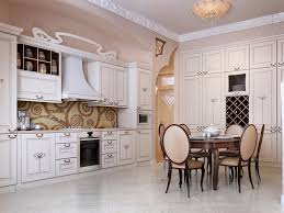 A mix of black and white marble, along with black stools and cabinets, make for a sleek design. 30 Elegant White Kitchen Design Ideas For Modern Home