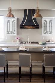 Range hoods are extremely helpful in keeping a modern kitchen clean. Gold And Black Kitchen Vent Hood Transitional Kitchen