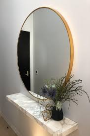 Polished surface (of metal, coated glass, etc.) used to reflect images of objects, especially the face… see definitions of mirror. Bella Mirror Brass Stella Round Brass Mirror