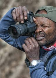 Maybe you would like to learn more about one of these? Close Up Of African American Man Taking A Picture Taking A Photo Photographing Stock Photo 179897478