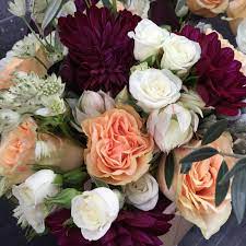 Wedding bridal bouquet in the on trend 'marsala' colour. Burgundy Peach And White Wedding Flowers Floral Artistry