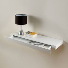 A bedside cabinet resembles a bedside table, but with drawers or a small cupboard door. Floating Shelf With Drawer Floating Drawer Floating Shelves