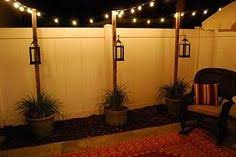 These have a unique honeycomb design that, when lit, casts a great design below the bulb. 48 Fence Lighting Ideas Backyard Fence Lighting Backyard Patio