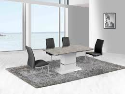 The best way to style a marble top dining room table is to pair it up with chairs in the same decorative style but in a contrasting color: Ireland Marble Dining Set Furtado Furniture