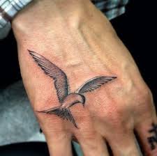 Guy Bird Tattoo On Ribs Black Birds Flying Tattoo Different Types Of Little Birds Tattoo On Hand Masculine Bird Tattoos For Men On Hand Tattoos For Guys Tattoos For Guys Hand Tattoos
