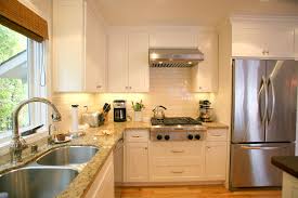 White Wooden Kitchen Cabinet With Brown Marble Counter Top White Kitchen Cab Craftsman Kitchen Cabinets Craftsman Kitchen Cabinets White White Shaker Kitchen