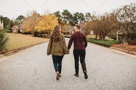Such as png, jpg, animated gifs, pic art, symbol, blackandwhite, picture, etc. Cute Couple Holding Hands And Walking Down Neighborhood Street Stock Photo Offset