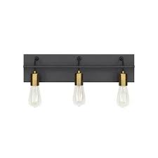 Black and gold is a combination that dates back to the time of ancient egypt, constantinople and rome. Lbl Lighting Tae 24 In W 3 Light Black Industrial Metal Bathroom Vanity Light With Aged Brass Socket Cups And Black Cords Ba1082blab The Home Depot
