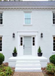 White and black painted brick house. Q A White Painted Brick Exteriors Becki Owens