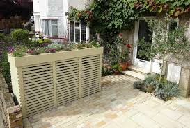 I have three wheelie bins that i keep in my back gard. How To Hide Wheelie Bins In A Garden