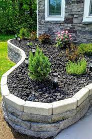 flower bed idea with black lava rock and retaining wall for curb appeal landscape curb landscaping with rocks front house landscaping rock garden landscaping