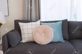 Designer cushion covers made with laura ashley slate grey mix n match pillows #wednesdaywisdom #cushions #madeintheuk. Pink And Blue Cushion On Grey Sofa In Living Room Stock Photo Picture And Royalty Free Image Image 117582229