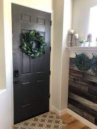I wanted a pop of color on the front door of the house. A Front Door Refresh With Urbane Bronze Paint