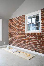 Wall of brick is possible to repaint if some stains occur. How To Paint A Brick Wall And Unify A Choppy Room Young House Love