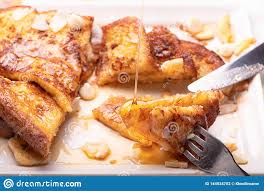 French Toast With Honey Syrup And Butter Delicious Sweet Breakfast With Coconut Flake White Chocolate And Dry Banana Stock Photo Image Of Food Breakfast 144534702