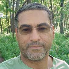 This is Wayne Irie (Positive Vibration). A DJ and Radio Presenter. He is 65  years old. Dear Lord, I want to look this sharp when I am 65. I pray for the