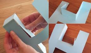 A piece of cardboard, glue stick, and a scissor. How To Make A 3d Letter Of Paper