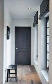 In the photo above, we cannot see the baseboard on the wall with the barn door, but we can see a base installed on the wall around the corner. Rescue Restore Redecorate No Baseboards House Doors Interior