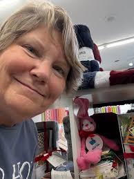 Hi..I'm trying to locate the quilter in the hideout who makes these cute  hanger quilts...anybody know the person? I need another one as this is  fading..ty in advance