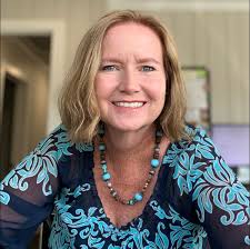 County Administrator, Jennifer Davis, presents Rachel Likens with a  certificate of appreciation for her 26 years of service as a Hendry County  employee.