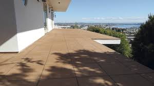 Want modern and clean looking patio flooring ideas for over concrete? Transforming Wood Decks With Decorative Concrete Concrete Decor