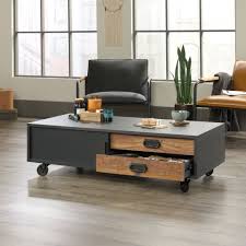 This hefty, but mobile, industrial coffee table comes in a warm tone of wood and metal. Industrial Coffee Table With Wheels Ideas On Foter
