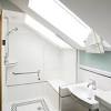 Attic bathrooms with sloping walls. 1