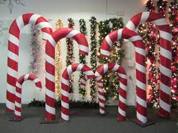 First we have our very own candy ornaments we made for our candyland christmas tree theme! Candy Cane Props From Frost Holiday Studio Rentals Christmas Decor Diy Christmas Wood Crafts Outdoor Christmas Decorations