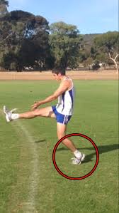 The football should be positioned in front of your kicking leg, from thigh to just above knee height. What Are The Basic Biomechanical Principles To Consistently Kick An Afl Football Drop Punt Successfully Gricho20