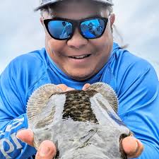 catching and cooking flounder with crab stuffing