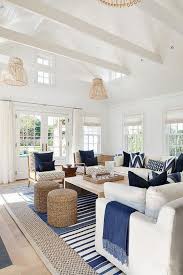 Traditional Coastal Living Room With A Tan And Navy Color Scheme In 2020 Coastal Style Living Room Coastal Decorating Living Room Beach House Living Room