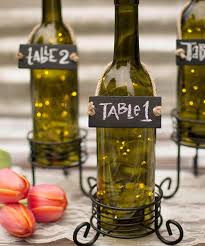 This allows for the stain and bare wood to peek through providing a unique vintage look. 10 Wine Bottle Centerpieces For Your Wedding Vinepair