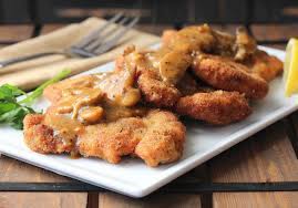 I love all things fried and my bottom hates me for it. German Schnitzel With Mushroom Gravy How To Feed A Loon Recipe Pork Schnitzel Pork Recipes Pork Entrees