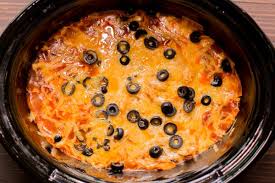 Layer half of the soup/sauce mixture on the tortillas, then half of the cheese, then sprinkle on diced onions if desired. Slow Cooker Chicken Enchilada Casserole The Magical Slow Cooker