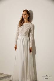 Modest Wedding Gown With Long Sleeves And Floral Lace Topaz Studio Levana Modest Wedding Gowns Perfect Wedding Dress Wedding Dress Long Sleeve