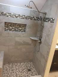 Apply mastic to the back of the pencil molding with a putty knife and press into place. Ivetta White Tiles And Mosaic Border Using The Durock Shower System Curb And Bench Tile Bathroom White Bathroom Tiles Glass Bathroom