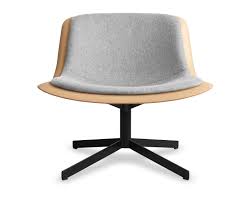 This modern lounge chair has a curved back with an opening between the tight upholstered seat. Nonesuch Swivel Upholstered Lounge Chair Blu Dot