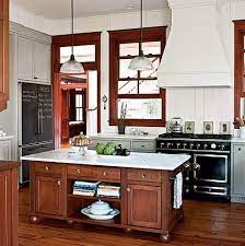 Metal cabinets stand out and attract attention, so you can choose a color that accents them well or tones down their metallic appearance. Easy Breezy Beautiful A House That Keeps Its Cool Hooked On Houses Stylish Kitchen Stylish Kitchen Island Dark Wood Trim