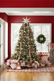 Best Christmas Tree Ribbon Ideas Ways To Add Ribbon To Your Christmas Tree Top view of wrapped green present with red ribbon. best christmas tree ribbon ideas ways