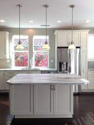 When autocomplete results are available use up and down arrows to review and enter to select. Kitchen Diamond Cabinets Leeton Door In Coconut Fantasy Brown Quartzite Glass Subway Tile B Glass Subway Tile Backsplash Home Remodeling Diamond Cabinets