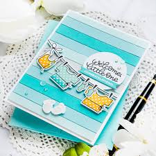 A baby shower is all about the fun of getting together, making a fuss over mom and showering her with all the cute gifts she and baby are going to need. Simon Says Stamp Welcome Little One Baby Card Yana Smakula