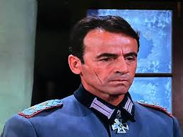 What is the origin of Burkhalter's scar in Hogan's Heroes?