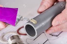 Cpvc & pvc plumbing pipe glue. Plumber Putting Glue On A Pvc Pipe Closeup Stock Photo Picture And Royalty Free Image Image 50831593
