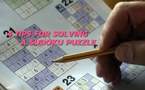 A sudoku grid begins with some numbers present and many missing. 4 Tips For Solving A Sudoku Puzzle