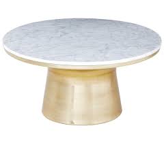 Lustrous marble forms the round tabletop. 18 White Marble Coffee Tables We Love