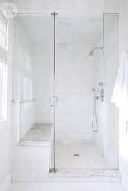 Glass tiles can also be done in deep blues and greens, which are near black in color. White Shower Tiles With Cream Mosaic Shower Floor Tiles Transitional Bathroom