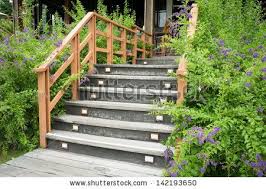 Stock Photo Stairs With Wooden Handrail In Garden 142193650 Jpg 450 320 Garden Stairs Outdoor Handrail Outdoor Steps