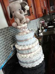 Get our guide to diying the popular baby shower centerpiece. Blue And Grey Elephant Theme Diaper Cake Elephant Baby Shower Boy Elephant Baby Shower Theme Diaper Cake